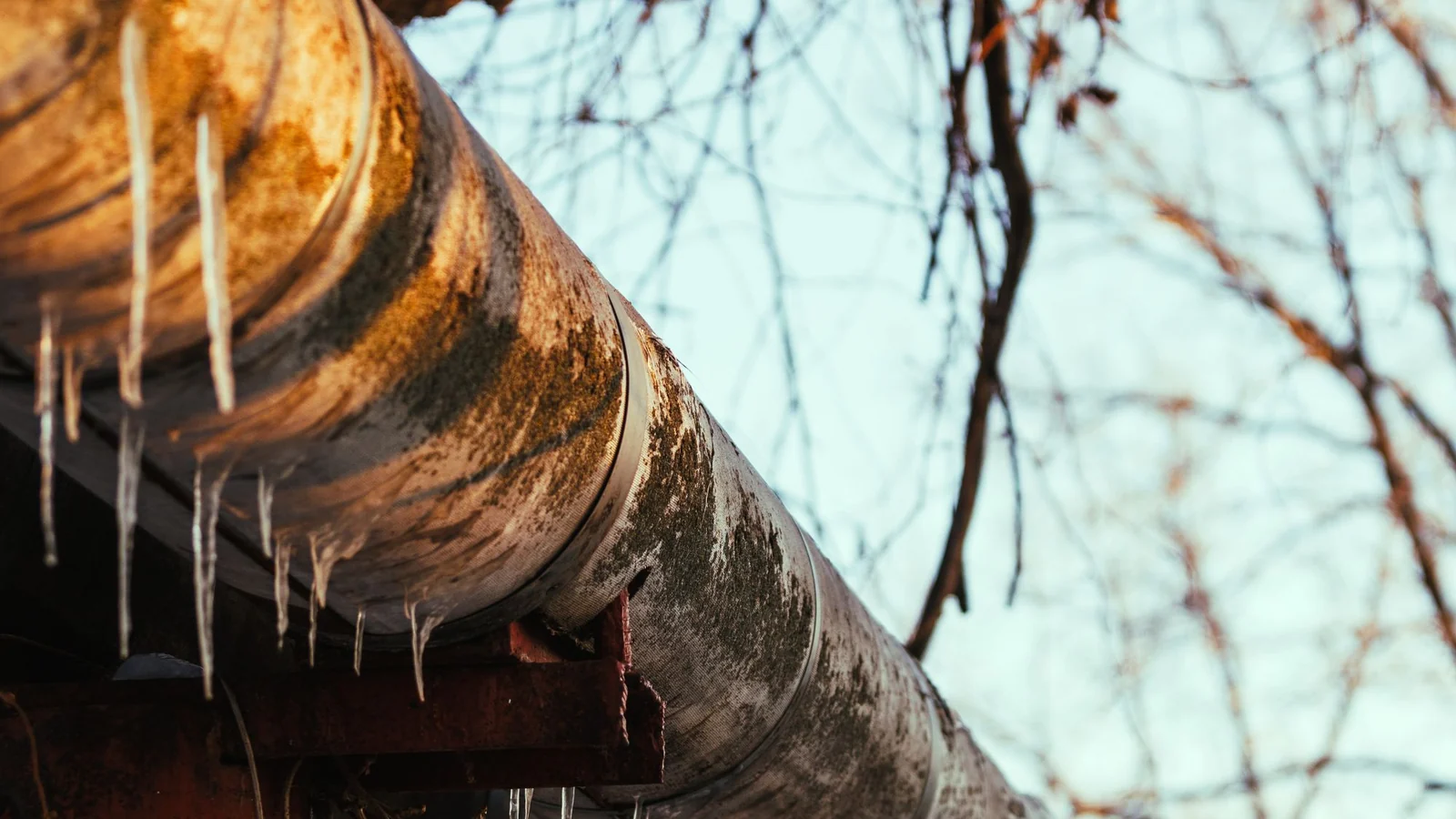 Frost on an outdoor industrial compressed air pipe run